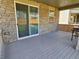 Private back porch featuring composite decking and brick accents, perfect for outdoor relaxing at 656 N Bersshine St, Watkins, CO 80137