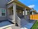 Charming front porch with stone accents, a covered entryway, and great curb appeal at 656 N Bersshine St, Watkins, CO 80137
