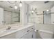 Classic bathroom with decorative lights, marble countertop and decorative mirror at 130 N Pearl St # 1103, Denver, CO 80203