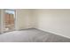 Bedroom with neutral carpet, bright window view with buildings visible at 130 N Pearl St # 1103, Denver, CO 80203