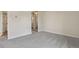 Bedroom featuring soft gray carpet, a mirrored closet, and view into the bathroom at 130 N Pearl St # 1103, Denver, CO 80203