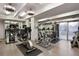 Well-lit fitness center with modern exercise equipment and mirrored walls for a complete workout experience at 130 N Pearl St # 1103, Denver, CO 80203