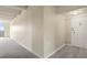 Hallway featuring carpet floors, neutral paint and door to enter the home at 130 N Pearl St # 1103, Denver, CO 80203