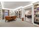 Reading room with well stocked book shelves, seating and easy access to other areas at 130 N Pearl St # 1103, Denver, CO 80203