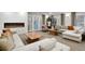 Comfortable living area with fireplace, large windows, and stylish neutral decor at 130 N Pearl St # 1103, Denver, CO 80203
