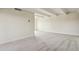 Bright and spacious living room featuring neutral carpet, white walls, and ceiling beams for a modern feel at 130 N Pearl St # 1103, Denver, CO 80203
