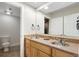 Bathroom with double sink vanity, tile countertop and flooring, and good lighting at 2089 Meadow Sweet Ln, Erie, CO 80516