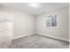 Bedroom featuring an egress window and neutral carpeting and paint and white trim at 2089 Meadow Sweet Ln, Erie, CO 80516
