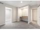 Bedroom with a built-in desk, closet and window with natural light, and neutral carpeting at 2089 Meadow Sweet Ln, Erie, CO 80516