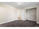 Carpeted bedroom features a closet with shelving and view to hall at 2089 Meadow Sweet Ln, Erie, CO 80516