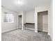 Bedroom with a built-in desk, closet and window with natural light, and neutral carpeting at 2089 Meadow Sweet Ln, Erie, CO 80516