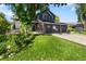 Charming two-story home with a three-car garage, well-manicured lawn, and solar panels at 2089 Meadow Sweet Ln, Erie, CO 80516