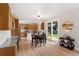 Open eat-in kitchen with backyard access through sliding glass doors and stainless appliances at 2089 Meadow Sweet Ln, Erie, CO 80516