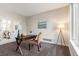 Cozy office with neutral carpeting, bright natural light, and French doors at 2089 Meadow Sweet Ln, Erie, CO 80516
