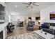 Spacious and open living area showcasing the living room, dining room, and kitchen at 15842 Willow St, Brighton, CO 80602