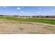 Expansive backyard featuring a manicured lawn and distant houses, providing ample space for recreation and relaxation at 15842 Willow St, Thornton, CO 80602