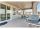 A covered outdoor patio featuring a grill and dining table, perfect for hosting gatherings and enjoying outdoor dining at 15842 Willow St, Thornton, CO 80602