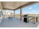 A covered outdoor patio featuring a grill and dining table, perfect for hosting gatherings and enjoying outdoor dining at 15842 Willow St, Thornton, CO 80602