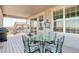 Inviting outdoor patio featuring a dining table and chairs, perfect for enjoying meals and relaxing in the fresh air at 15842 Willow St, Thornton, CO 80602