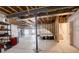 Unfinished basement space with exposed beams and framed walls, ready for customization at 15842 Willow St, Thornton, CO 80602