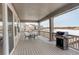 Inviting covered deck with outdoor seating and a grill, perfect for entertaining and enjoying the view at 15842 Willow St, Thornton, CO 80602