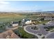 A beautiful community clubhouse with circular drive and lush landscaping set against a prairie landscape at 8354 Big Thompson St, Littleton, CO 80125