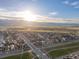 Panoramic aerial view of a new residential development with scenic mountain backdrop at sunset at 8354 Big Thompson St, Littleton, CO 80125