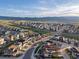 Expansive aerial view of the neighborhood showcasing mountain views, modern homes and streetscapes at 8354 Big Thompson St, Littleton, CO 80125