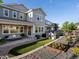 Landscaped backyard with lawn, flower beds, and patio at 8354 Big Thompson St, Littleton, CO 80125