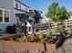 Beautiful backyard with flower garden, playhouse, and privacy fence at 8354 Big Thompson St, Littleton, CO 80125