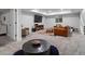 Open basement rec room with TV, seating, and room for entertaining at 8354 Big Thompson St, Littleton, CO 80125