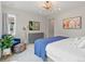 Cozy bedroom with blue accents, dresser, and stylish decor at 8354 Big Thompson St, Littleton, CO 80125