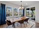 This stylish dining room offers plenty of natural light and patio access at 8354 Big Thompson St, Littleton, CO 80125