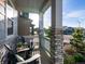 Inviting front porch with comfortable seating and attractive landscaping at 8354 Big Thompson St, Littleton, CO 80125