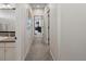 Hallway with neutral colors, leading to rooms, decorated with modern style at 8354 Big Thompson St, Littleton, CO 80125