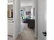 Clean, well-lit hallway leading to bedrooms and bathroom; with stylish decor and natural light at 8354 Big Thompson St, Littleton, CO 80125