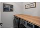 Well-organized laundry room with modern appliances and ample counter space for folding and sorting at 8354 Big Thompson St, Littleton, CO 80125