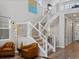 Elegant living room features a split staircase, lots of natural light and modern furnishings at 8354 Big Thompson St, Littleton, CO 80125