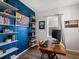 Cozy home office boasts custom built-in shelving and lots of natural light at 8354 Big Thompson St, Littleton, CO 80125