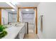 Bright bathroom features a large vanity and tiled shower/tub combo at 2525 S Dayton Way # 1514, Denver, CO 80231
