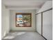 Bright bedroom with large window, closet with sliding doors, and neutral carpet at 2525 S Dayton Way # 1514, Denver, CO 80231