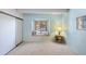 Bright bedroom features a window seat, plush carpet, and neutral wall paint at 2525 S Dayton Way # 1514, Denver, CO 80231