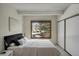 Bright bedroom with large window, closet and neutral carpet at 2525 S Dayton Way # 1514, Denver, CO 80231