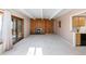 Open-concept living room featuring a cozy fireplace and access to an outdoor deck at 2525 S Dayton Way # 1514, Denver, CO 80231