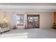 Bright living room with large windows and sliding doors to the outdoor deck at 2525 S Dayton Way # 1514, Denver, CO 80231