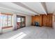 Cozy living room features a fireplace and access to a balcony with natural light at 2525 S Dayton Way # 1514, Denver, CO 80231