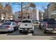 Parking lot with several parked cars in front of a building at 2525 S Dayton Way # 1514, Denver, CO 80231