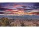 Scenic view of a vibrant sunset over snow-capped mountains and nearby houses at 2525 S Dayton Way # 1514, Denver, CO 80231