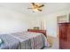 This bedroom boasts a ceiling fan and easy access to the ensuite bathroom at 5895 Biscay St # D, Denver, CO 80249