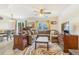 Cozy living room featuring a large sectional sofa, stylish rug, ceiling fan, and abundant natural light at 5895 Biscay St # D, Denver, CO 80249